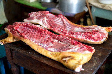Traditional homemade pig slaughtering on the table in the village.
