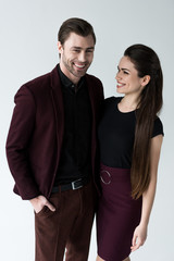beautiful smiling couple, isolated on grey