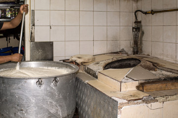 Man Cooking In A Real Grungy Dirty Restaurant Industrial & Commercial Kitchen