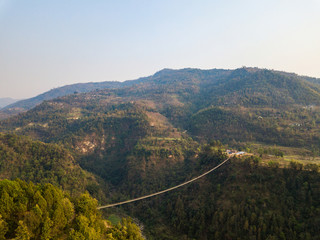 Fototapeta na wymiar Drone view of the suspension bridge over the Modi river in Kushma, Nepal