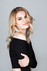 Fototapeta premium Cute Smiling Womanl with Blonde Curly Hair