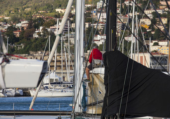  Italian sailor working on tree of sailboat