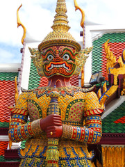 Statue of a giant Thai standing in the Emerald Buddha, Bangkok, Thailand.