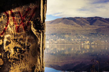 landscape of Lake Varese, through a broken wall,varese,Lombardy,Italy