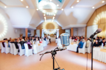 Microphone on blurred of speech in seminar room