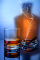 Whisky with cigar and smoke in the form of background.