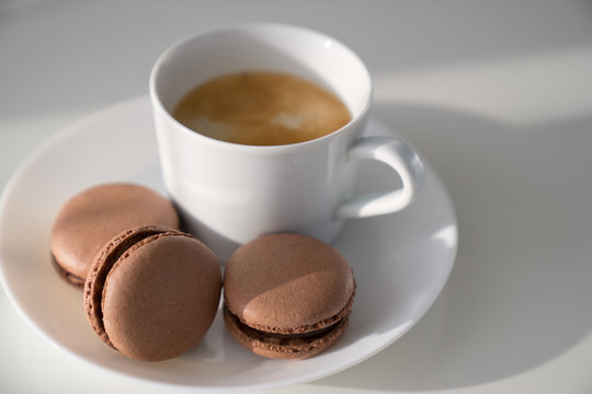 Macaroon and Coffee on white table