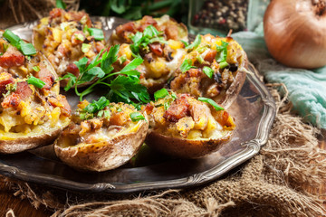 Baked potatoes stuffed with bacon, mushrooms and cheese