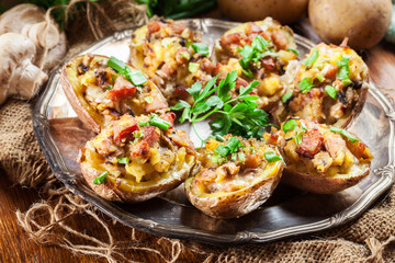 Baked potatoes stuffed with bacon, mushrooms and cheese