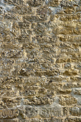 Old lichen covered  limestone wall background texture
