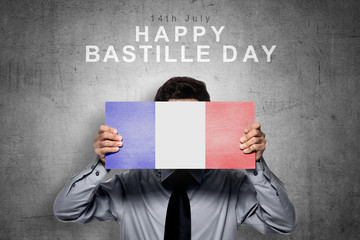 Businessman holding board with france flag color