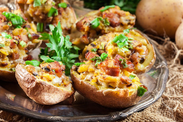 Baked potatoes stuffed with bacon, mushrooms and cheese