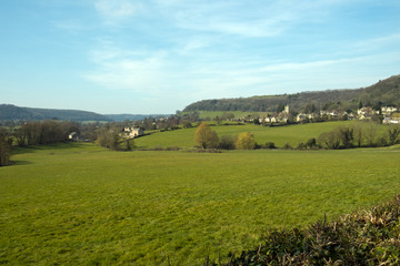 Fototapeta na wymiar Picturesque Uley village on the edge of the Cotswold Hills escarpment in spring sunshine, Gloucestershire, UK.
