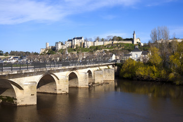 Fototapeta premium Chinon town and chateau seen beyond the bridge over the Vienne Rive, Indre-et-Loire, France