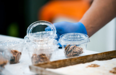 Confectioner preparing cookies, confectionery industry