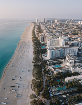 Aerial view of sandy beach with sun loungers, Miami Beach, Florida, USA