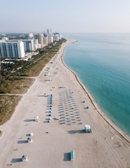 Obraz premium Aerial view of sandy beach with sun loungers, Miami Beach, Florida, USA