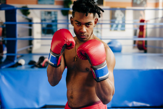 Ethnic fighter with fist forward