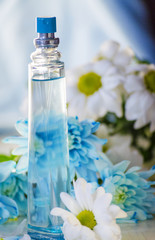 perfume bottle on a background of flowers