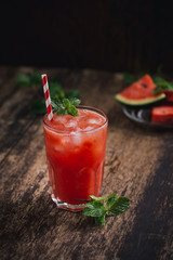 Refreshing summer watermelon juice in glasses with slices of watermelon