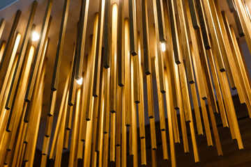 texture of wooden sticks hang from the ceiling at outdoor constructions