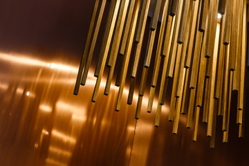 texture of wooden sticks hang from the ceiling at outdoor constructions