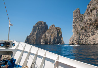 View from the boat on the Faraglioni Rocks on Capri Island, Italy.