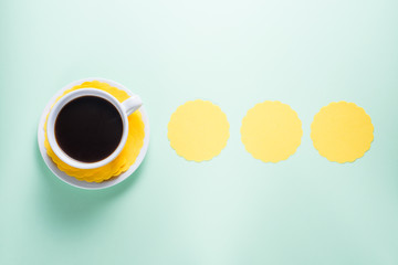 Cup of coffee on colorful background