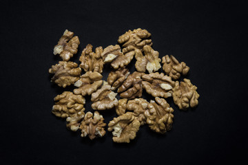 Walnuts on black  background. Copy space. Concept.