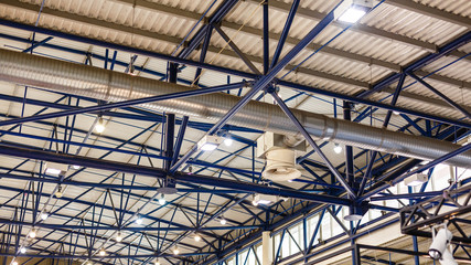 Spotlight hanging on the white ceiling.