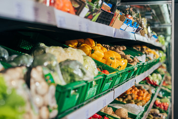 close up view of arranged fresh vegetables in grocery shop