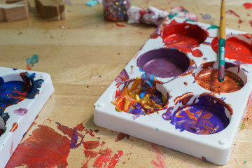 Children Drawing Board with Picture wooden frame and Paintbrush palette water Oil color on table