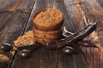 Carob powder and beans.