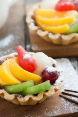 Tart with lemon curd and fresh fruit, top view

