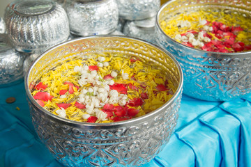 The younger traditionally sprinkle water onto their parents' and grandparents' hands
