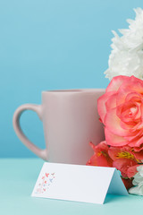 Love background with pink roses, flowers, gift on table