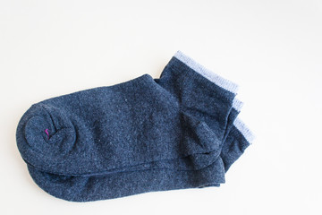 Gray socks on a light background. Candid, copy space.