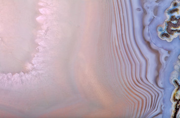 slice of light pink and blue agate mineral