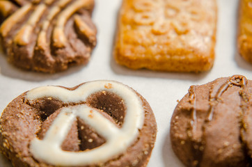 assorted cookies on wooden tray