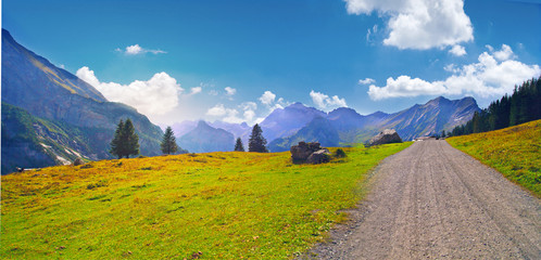 beautiful landscape with a road, panorama of wonderful mountains and forests, Alps, Switzerland
