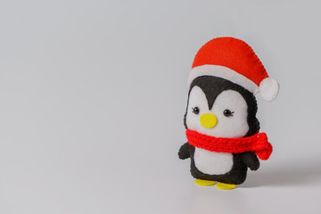 hand toy penguin. Christmas decoration of deer. Soft toy