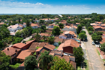 Fototapeta na wymiar Elevated view of a residential neighborhood in Asuncion, the capital of Paraguay, with traditional spanish style houses.