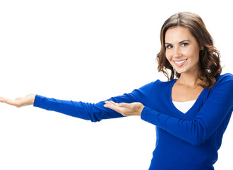 Beautiful young woman showing, on white