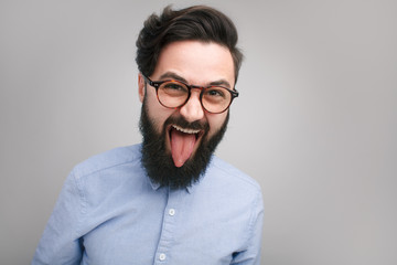 Crazy expressive hipster in glasses