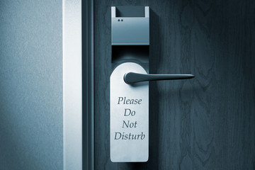 3D rendering of a knob of a hotel door with "Please do not disturb" tag