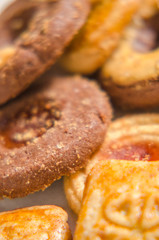 assorted cookies on wooden tray