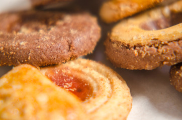assorted cookies on wooden tray