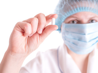 Doctor keeps, offering the pill