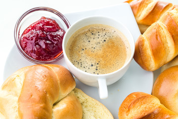 Breakfast, brunch, coffee with homemade pastries on white background with flowers