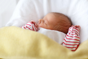 Portrait of cute adorable newborn baby girl sleeping